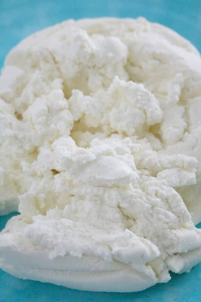 This picture of Ricotta Cheese takes just 4 simple ingredients and about 15 or 20 minutes to make. Creamy, light white, spreadable whole milk ricotta cheese. 