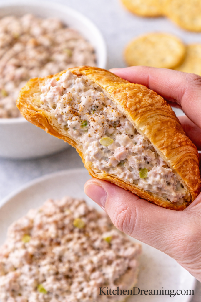 Best Ham Salad Recipe – Old Fashioned, Creamy, Easy to Make 6 Ham salad recipe served inside a flaky croissant sandwich with visible filling.