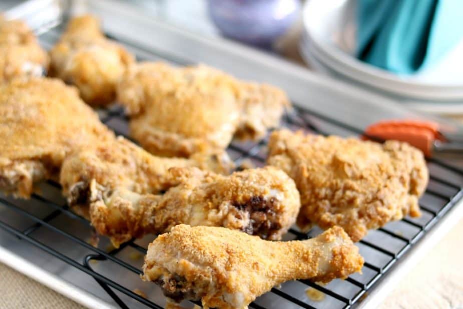 a landscape photo of a tray of oven fried chicken.