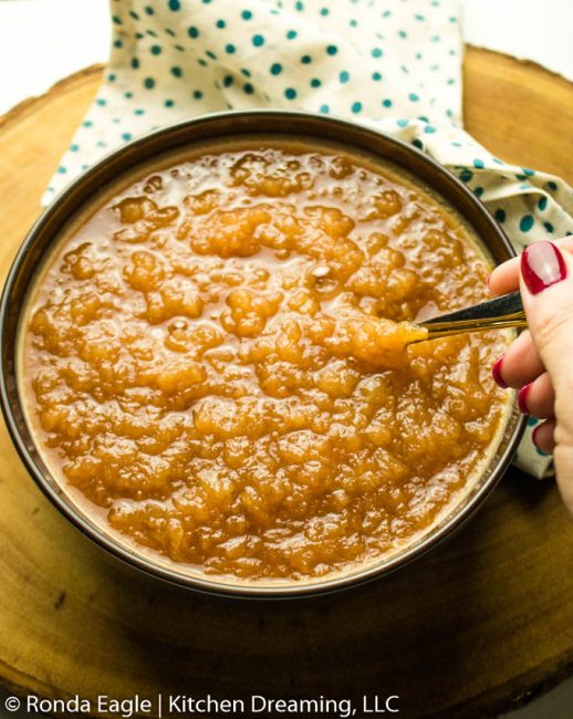 an image of a bowl of crock pot cinnamon applesauce. 