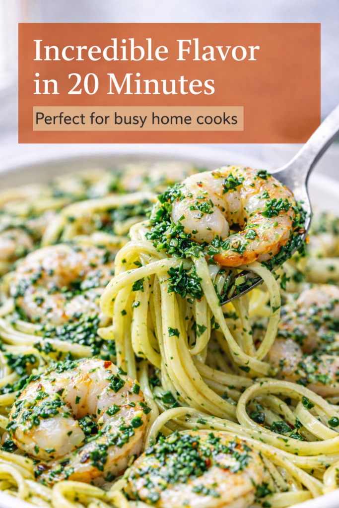 Chimichurri Shrimp Pasta with Fresh Herb Garlic Sauce 10 Close-up of chimichurri shrimp pasta with glossy herb sauce and shrimp on a fork.
