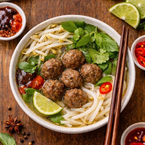 Dump and go crockpot pho with beef meatballs, rice noodles, herbs, lime, and bone broth for an easy weeknight pho recipe.