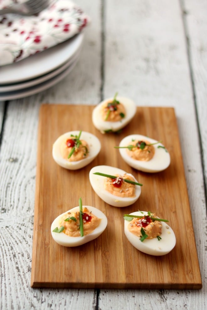 Looking for different ways to dress up deviled eggs to appease the spice lovers on your list? One simple way is with an Asian flair on this classic appetizer.