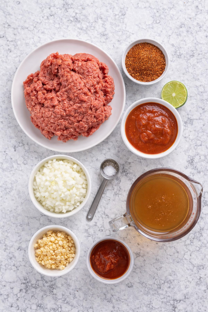 Best Slow Cooker Taco Meat (Easy Crockpot Recipe for Tacos & Meal Prep) 2 Ingredients for slow cooker taco meat laid out overhead on a countertop