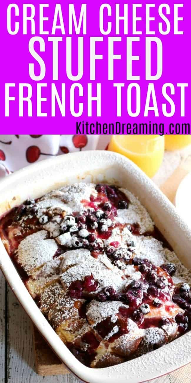 a pan of french toast casserole topped with homemade blueberry sauce.