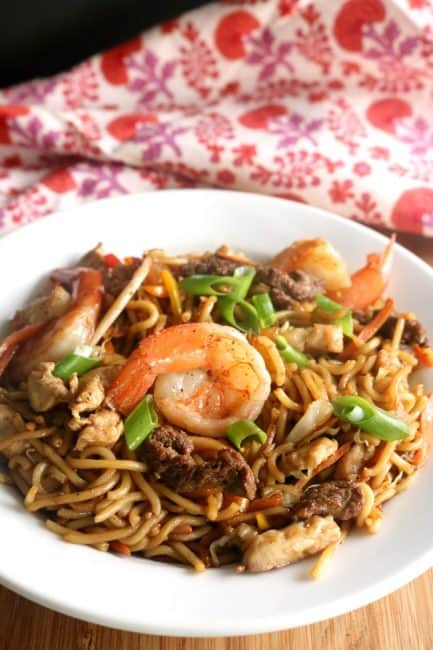 A bowl of house lo mein loaded with noodles, vegetables, shrimp, chicken and beef.