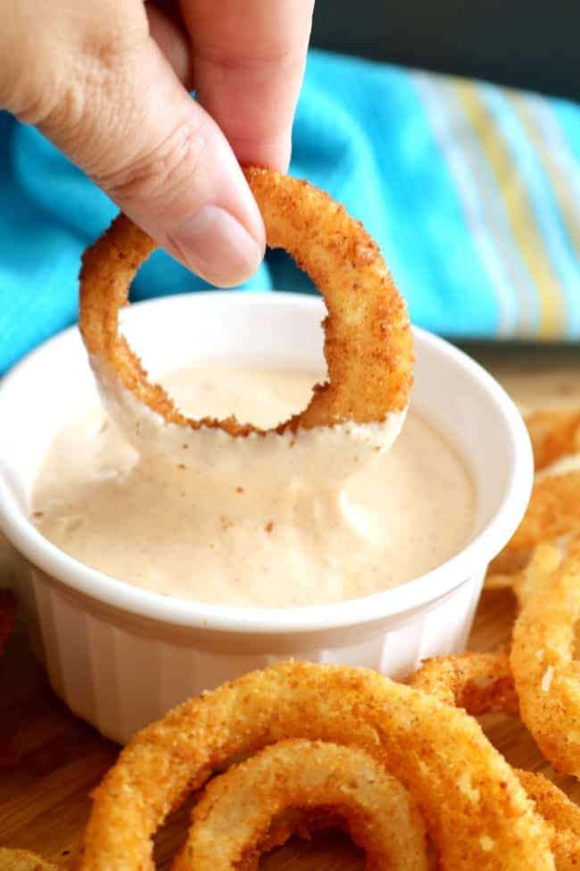 Crispy bread crumb coating and a wet batter come together to make this classic onion ring. With a thick, tangy sauce, it's the perfect combination.