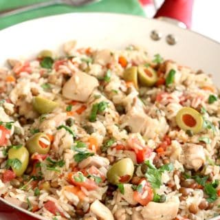 Bursting with flavor, this Puerto Rican version of Skillet Caribbean Chicken and Rice is easy to make and ready in just about 30 minutes.