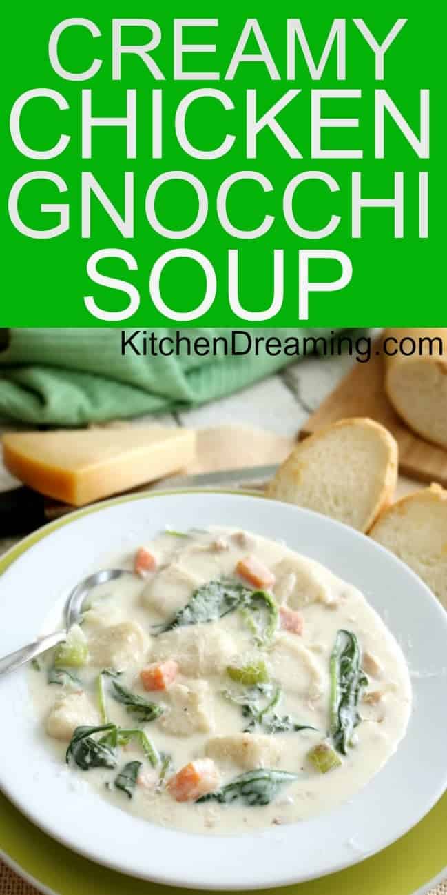 a pinnable image of chicken gnocchi soup in a bowl with bread and parmesan cheese in the background.