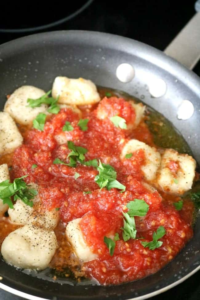A simple fresh pomodoro tomato sauce over pillowy, soft gnocchi. Gnocchi in Pomodoro Sauce; it's what's for dinner. Yum. 
