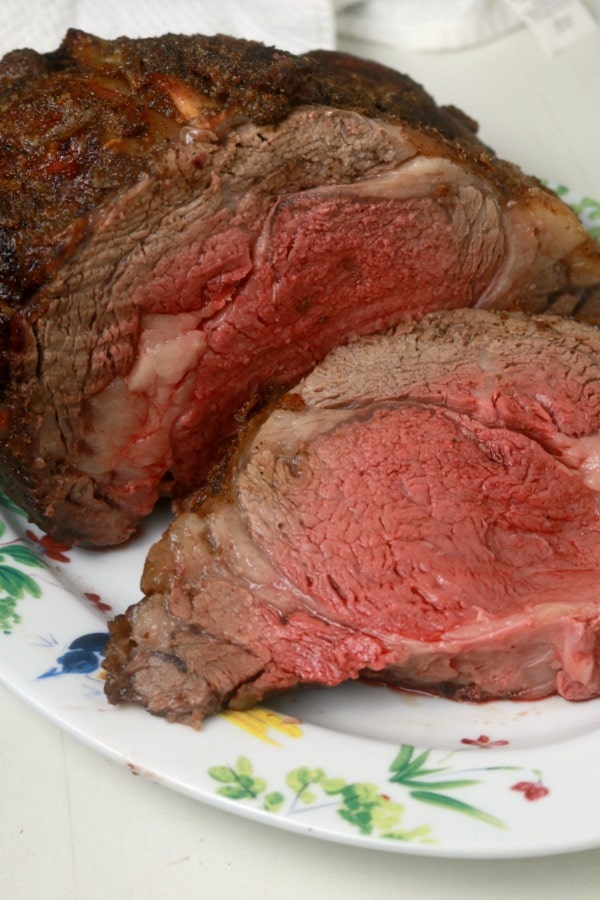 A perfectly medium rare prime rib sliced for serving.