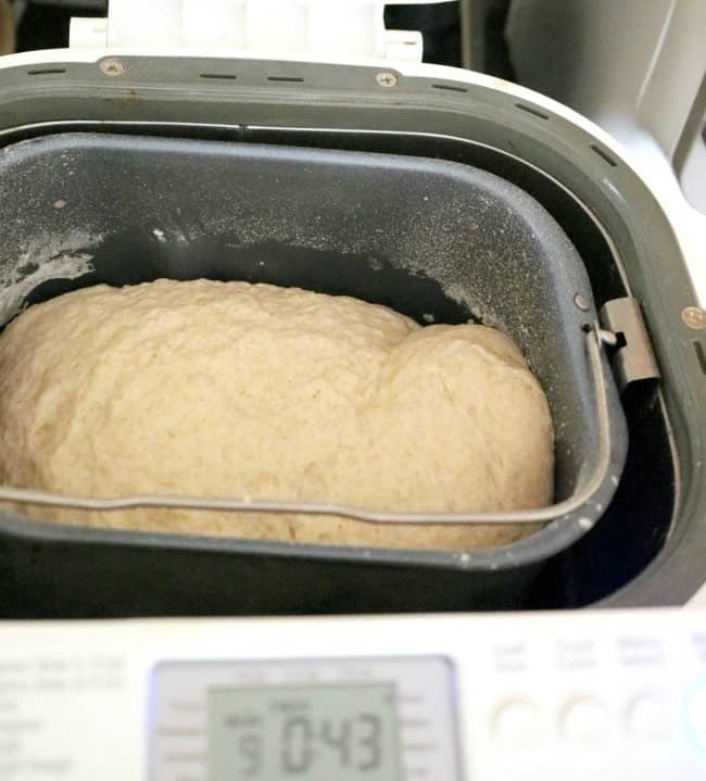 English muffin dough in the bread machine pan.