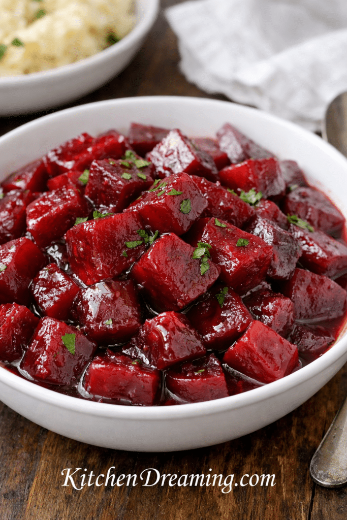 Classic Harvard beets recipe served in a white bowl with glossy sweet and sour glaze.