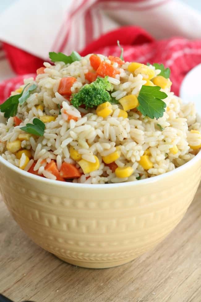 This quick and easy Garden Vegetable Rice is a favorite side dish for our family dinners. We can use any fresh or frozen vegetables we have on hand and tailor it to fit the flavors or style of our meal plan. It's a very simple dish using ingredients probably already in your pantry. 