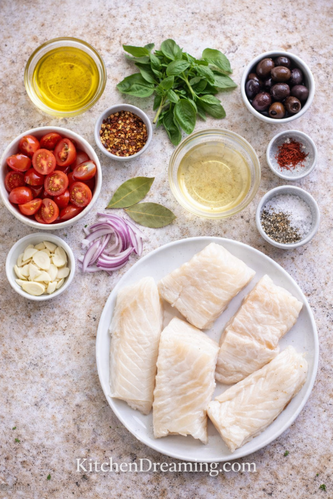 Mediterranean Poached Cod - A High Protein Low Calorie Dinner 2 Ingredients for Mediterranean Poached Cod including cod fillets, tomatoes, olives, wine, and saffron.