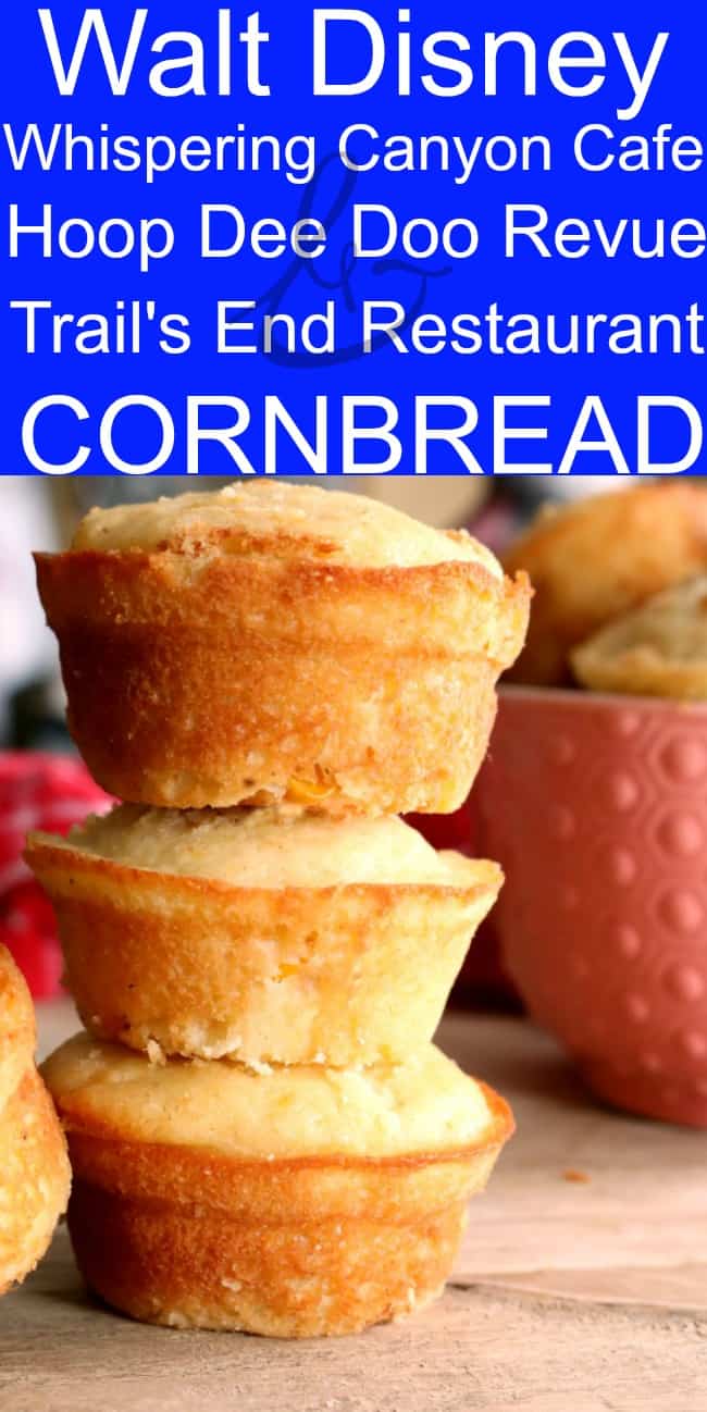 Cornbread stacked 3 tall on top of one another with a pink bowl and a red checkered towel in the background.