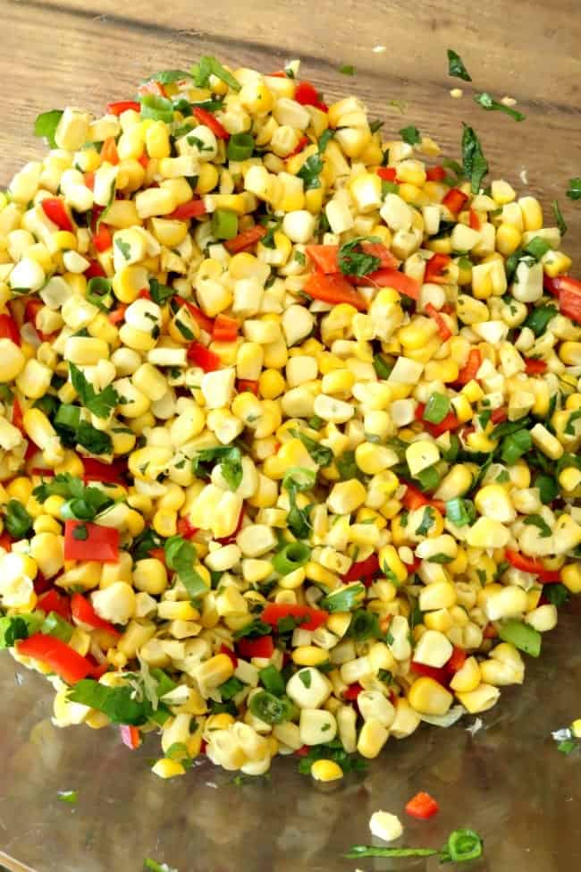 Why wait 'til summer for fresh, sweet corn when we can have it right now? This Hot jalapeño Corn Dip is packed with flavor starting with the fresh, steamed corn and then combined with chopped cilantro, diced jalapeños, and sliced green onions. The flavor of the sweet corn is showcased in this dip and is what makes this dish shine. My husband and I agreed the fresh corn is the difference you can taste in this dip and it's delicious!