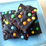 These chocolate ganache brownies start with a rich fudge brownie base and are topped with a decadent dark chocolate brownie frosting.