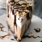 Throwing a party this summer? Cool off with this refreshing adult dessert - Frozen Mudslide Pie. Coffee liqueur, vodka, and Irish cream come together to form this amazing cocktail-inspired dessert. Your guests are going to totally love you for this - I promise!