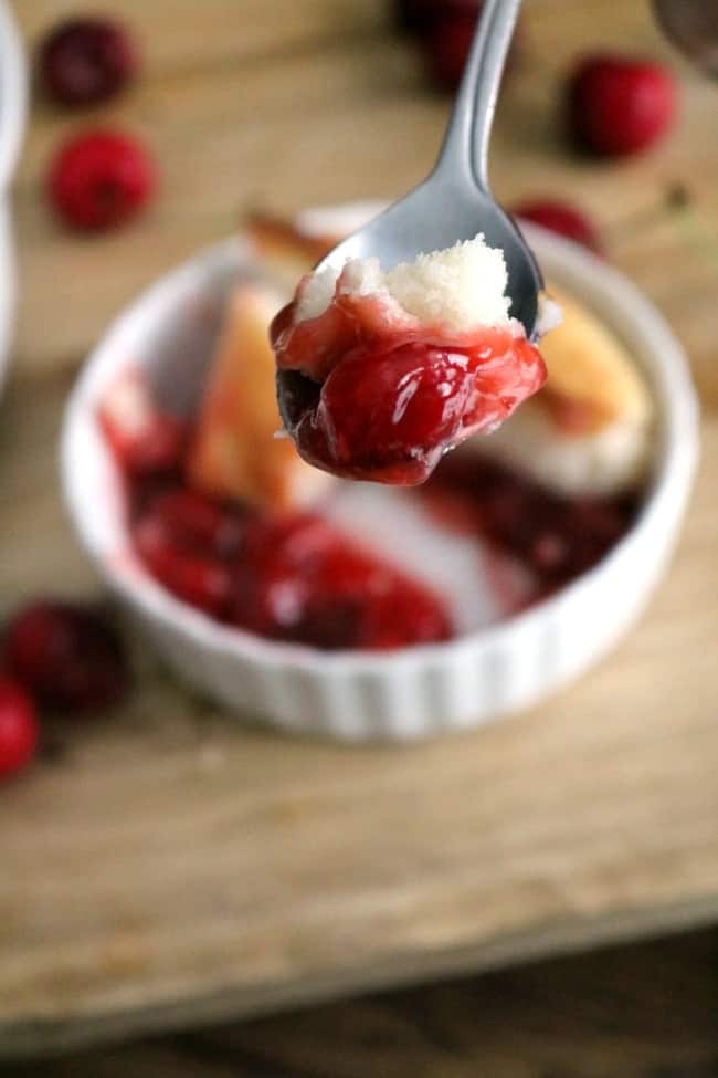 a close-up photo of a spoonful of easy cherry cobbler. Yum.