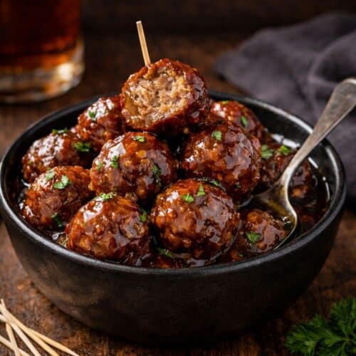 Easy bourbon meatballs coated in thick sauce served as a make ahead appetizer for parties.