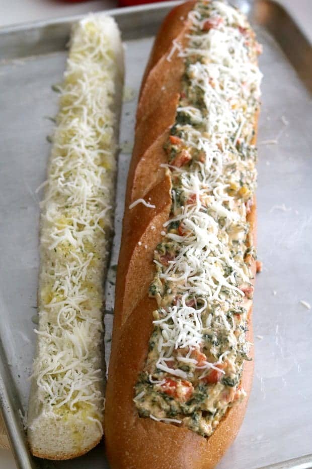 Spinach Dip Stuffed French Bread is hot and melty, ooey and gooey, carb-y and delicious. That's why Spinach Dip stuffed French Bread is the perfect party appetizer! #Party #Appetizers #Vegetarian #Holiday #Ideas