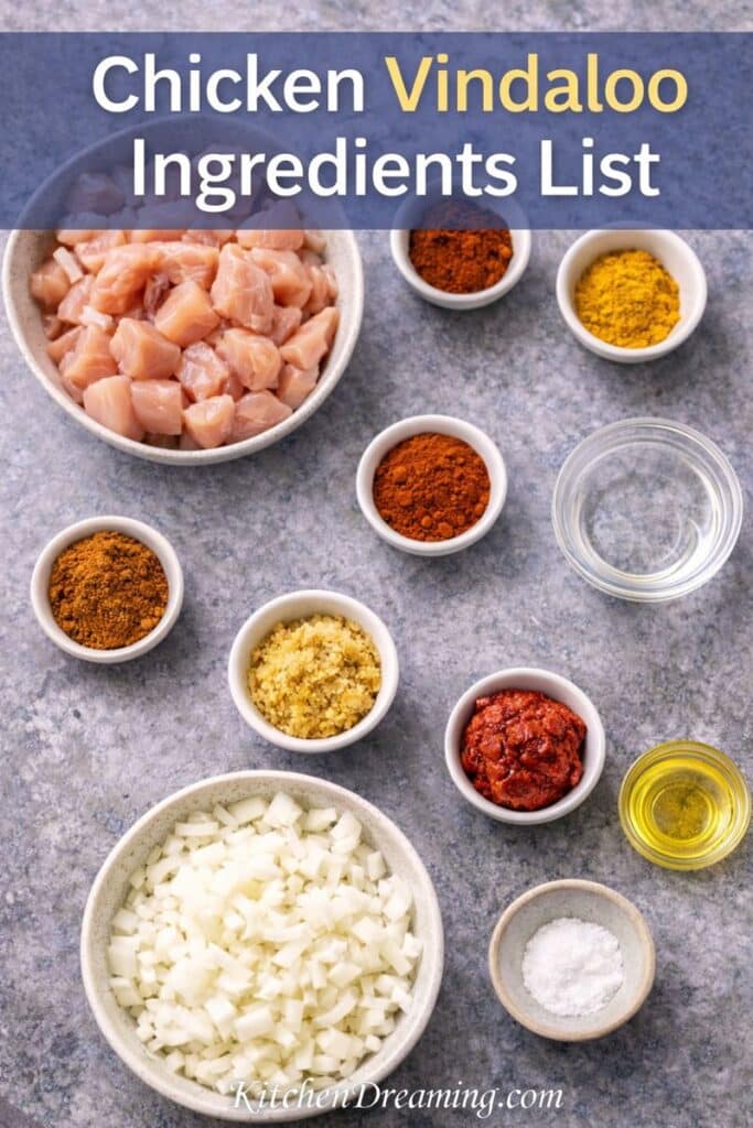 Chicken vindaloo ingredients arranged on a flat lay for an easy chicken vindaloo recipe using pantry spices.