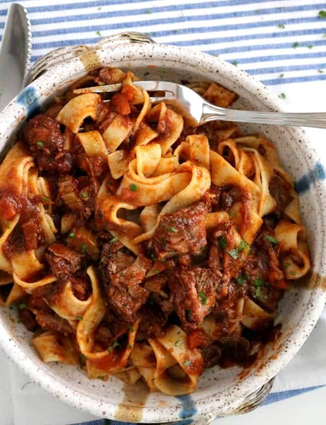 A staple of northern Italy, a ragu is a thick, full-bodied meat sauce that usually contains beef, tomatoes, onions, celery, carrots, and garlic. The already flavorful sauce is then further enhanced with wine and herbs. #Italian #Beef #Ragu #Sauce #Pasta #KitchenDremaing