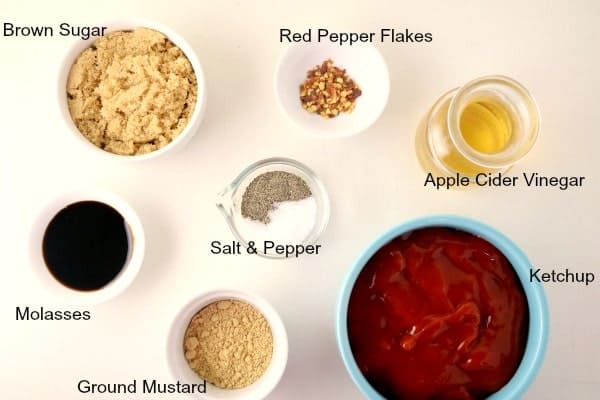 The basic ingredients of a homemade barbecue sauce: ketchup, apple cider vinegar, brown sugar, molasses, salt, pepper, ground mustard, and red pepper (chili) flakes. 