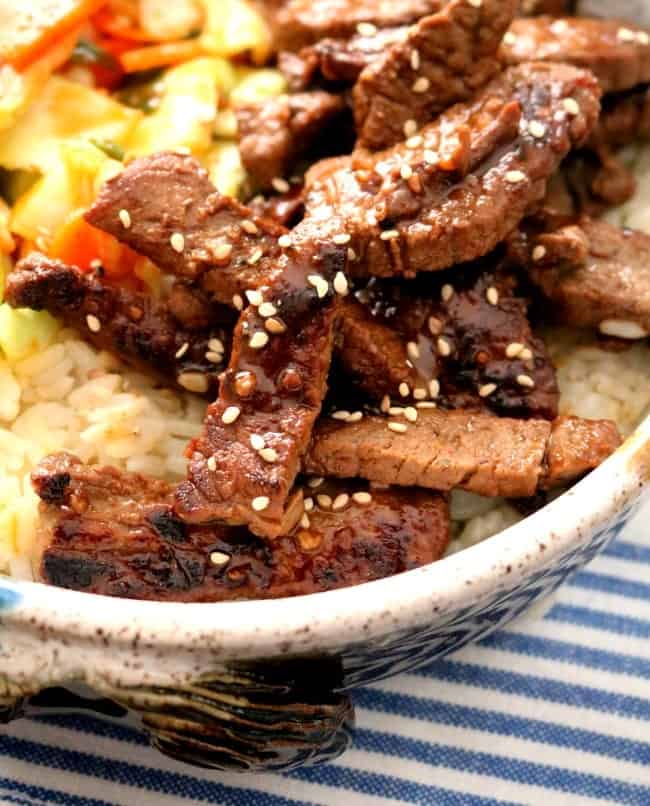 Close-up photo of Korean Beef Bowls with quick kimchi on a bed of rice.