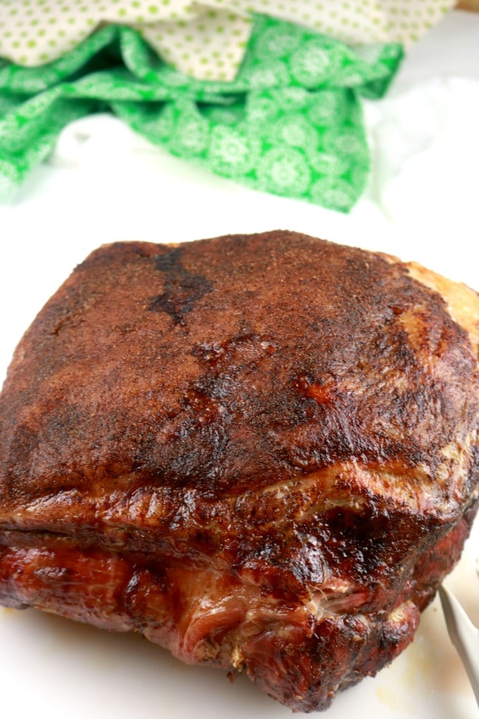 an image of a roasted whole pork butt fresh from the oven - look at that bark! perfectly succulent pork shoulder.