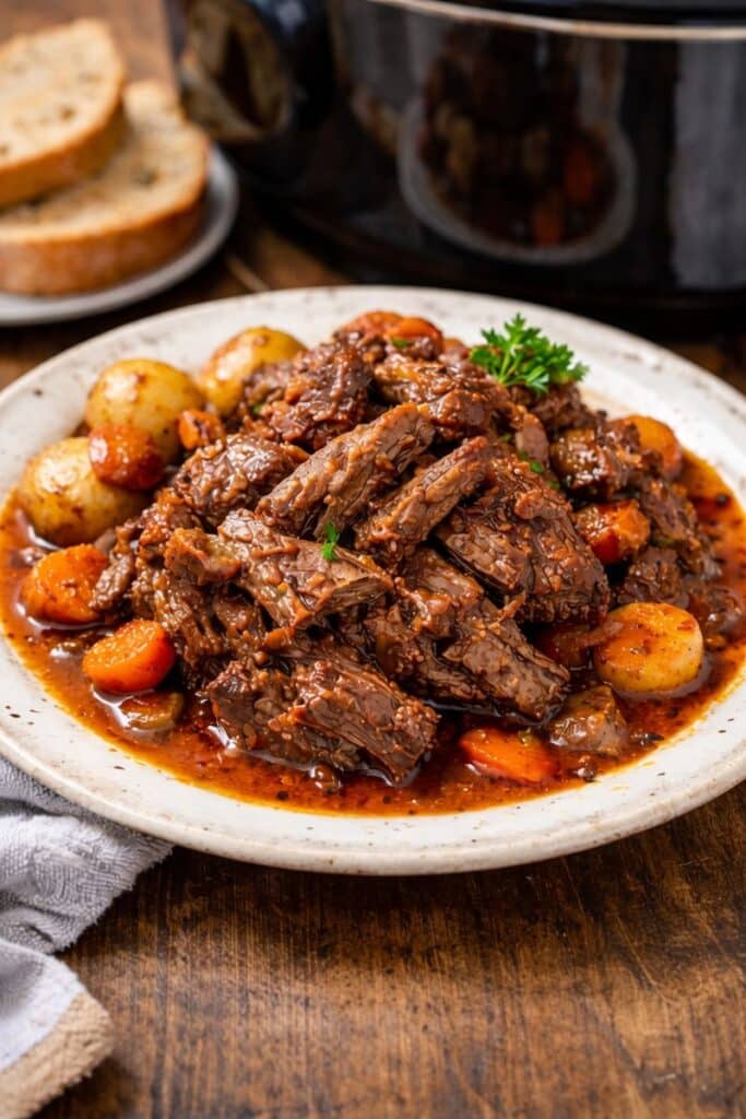 Slow Cooker Portuguese Pot Roast with tender shredded beef in garlic paprika sauce