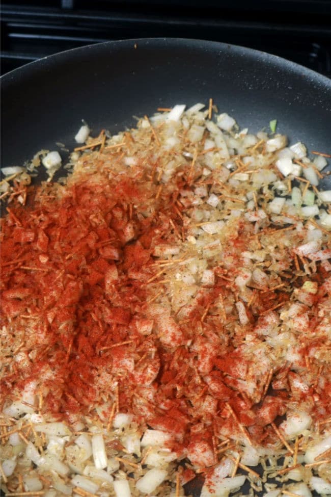 Paprika sprinkled over the top of the rice pilaf.