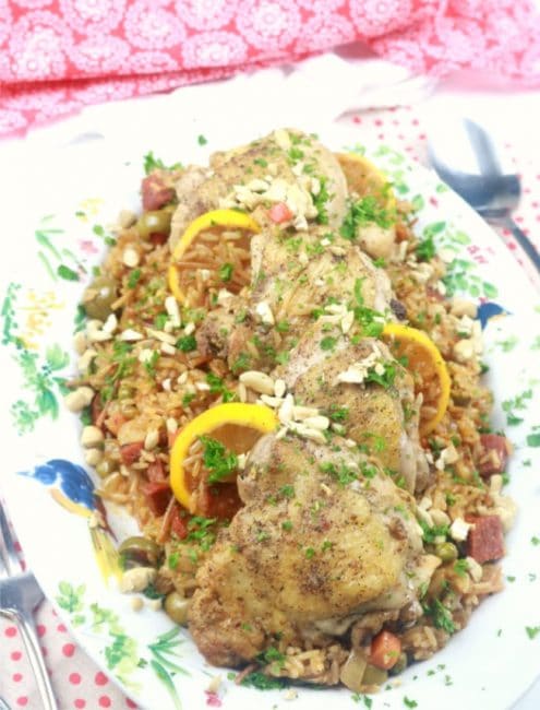 a platter of Spanish Chicken and Rice ready for serving.