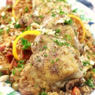 One Pan Spanish Chicken and Rice Pilaf plated on a family style platter close up image