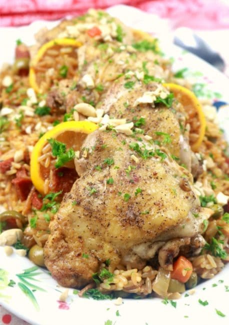 One Pan Spanish Chicken and Rice Pilaf plated on a family style platter close up image