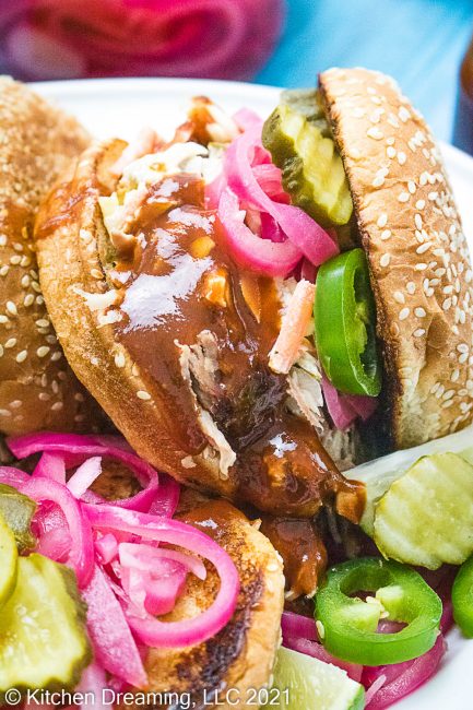 A close up image of a pulled pork sandwich.