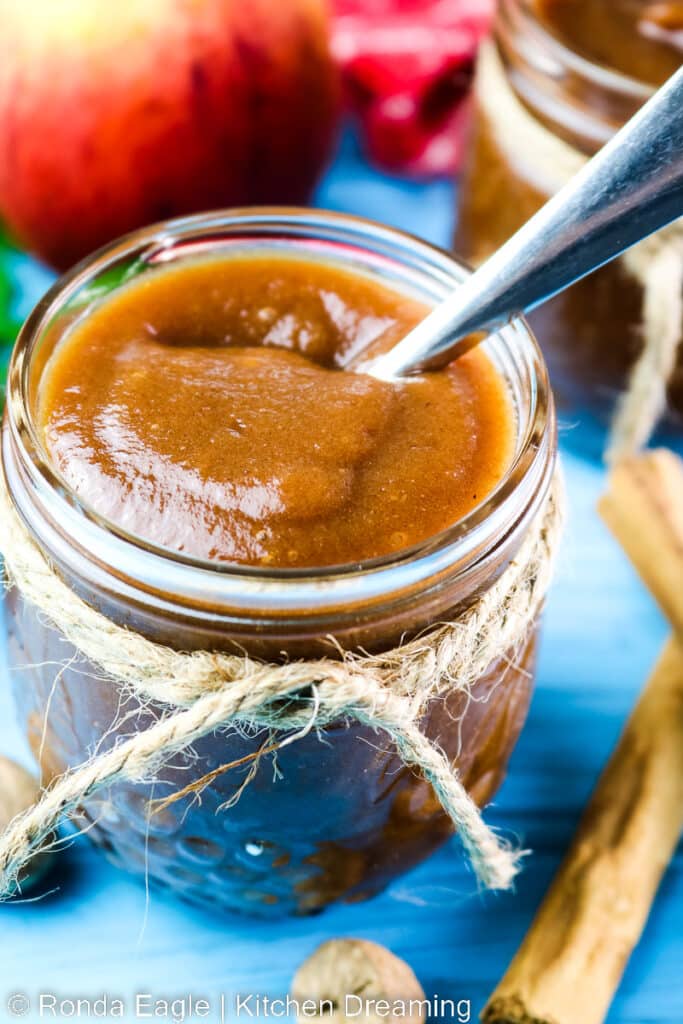 A close-up view of a jar of small batch apple butter.