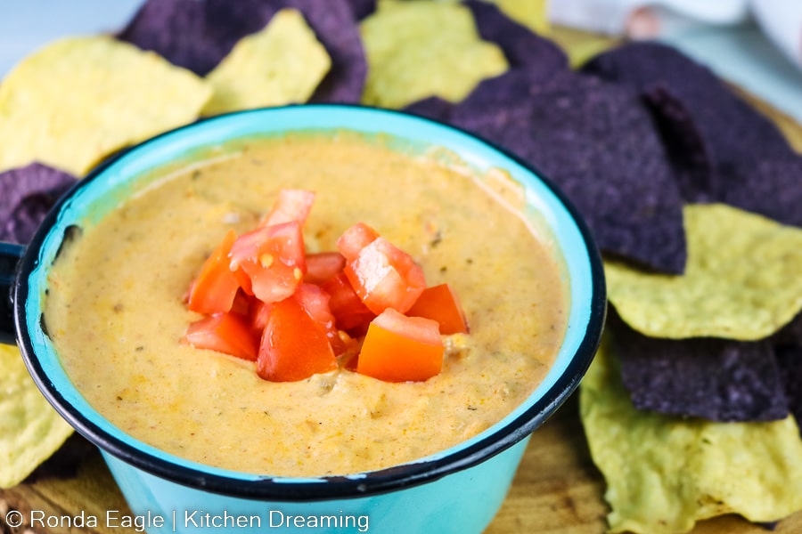 A close up image of the bowl of nacho cheese dip.