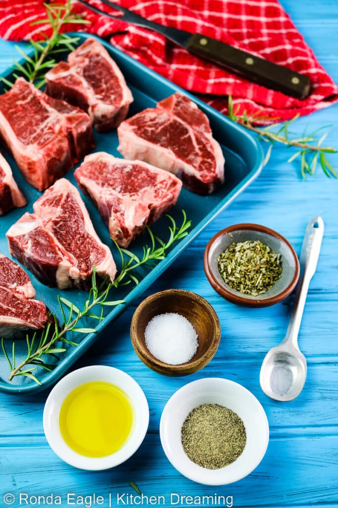 The ingredients for roasted lamb chops: lamb chops, olive oil, salt, ground black pepper, and fresh or dried herbs.