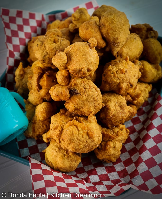 A tray of fried clam cakes,