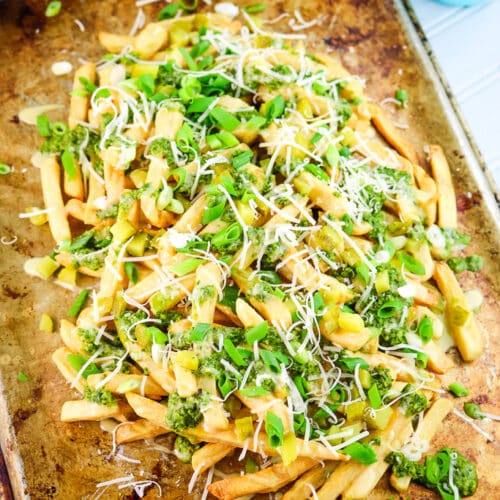 This savory Cuban fries recipe features French Fries, zesty chimichurri sauce, pickles, and aioli —a flavorful blend that captures the essence of Cuban cuisine.