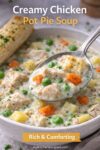 Close-up spoonful of creamy chicken pot pie soup with chicken, vegetables, and thick broth.