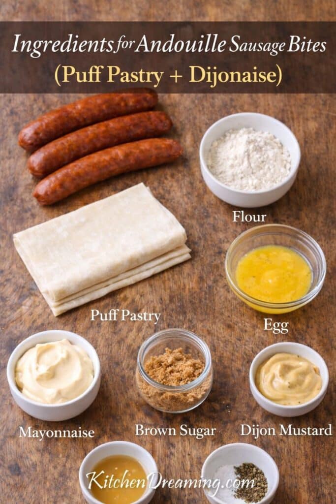 Ingredients for andouille sausage bites: andouille sausage, puff pastry, egg wash, flour, Dijon mustard, mayonnaise, brown sugar, apple cider vinegar, salt, and pepper.