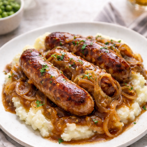 Bangers and Mash Recipe with Irish Ale Onion Gravy (Easy 30 Minute Dinner) 8 Bangers and mash recipe with browned sausages, creamy mashed potatoes, and Irish ale onion gravy.
