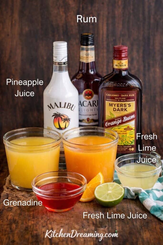 Caribbean Rum Punch Recipe ingredients, including pineapple juice, orange juice, fresh lime juice, grenadine, and rum.