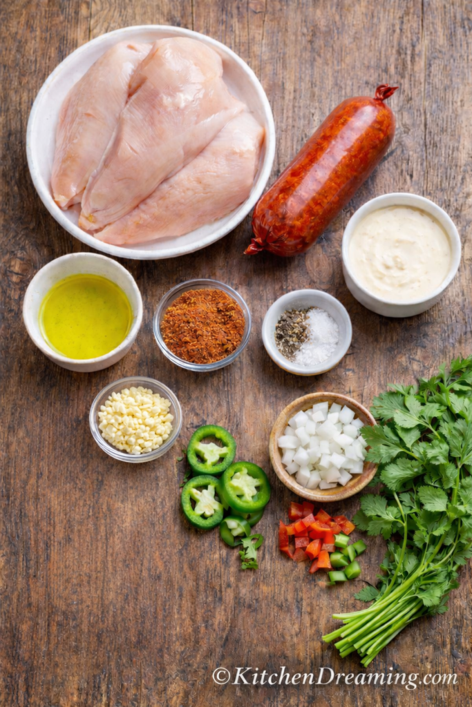 Chori Pollo - Easy Mexican-Style Chorizo Chicken 2 4 step collage showing how to make chori pollo recipe: cook chicken, brown chorizo, add queso sauce, and finish the skillet.