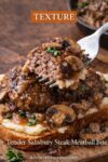 Close-up of a Salisbury steak meatball showing the juicy interior with mushroom gravy.