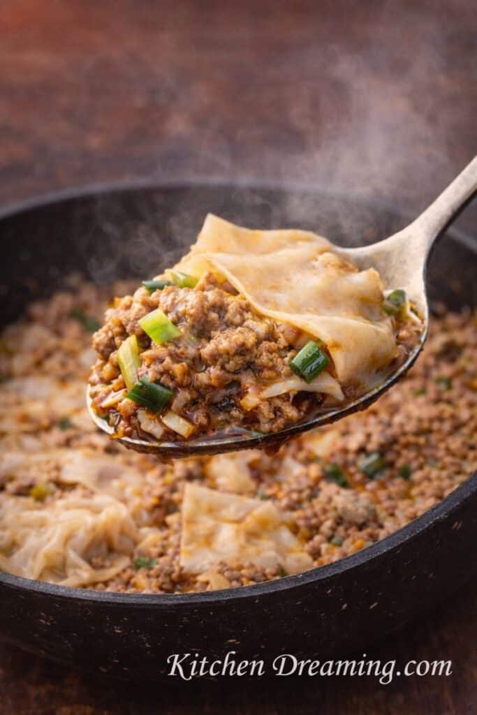 ngredient flat lay for one-pan pork dumpling lasagna with labeled items for quick reference. Includes dumpling wrappers, ground pork, aromatics, and sauces. Watermark reads KitchenDreaming.com.