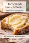 Close-up of fresh bread spread with homemade French butter, showing creamy texture and rustic farmhouse style.